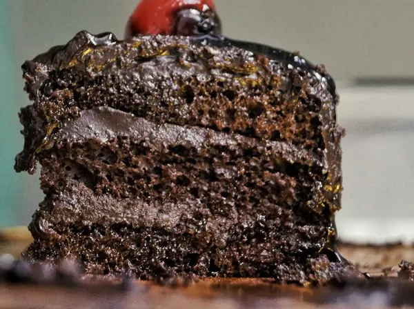 A slice of layered chocolate truffle cake